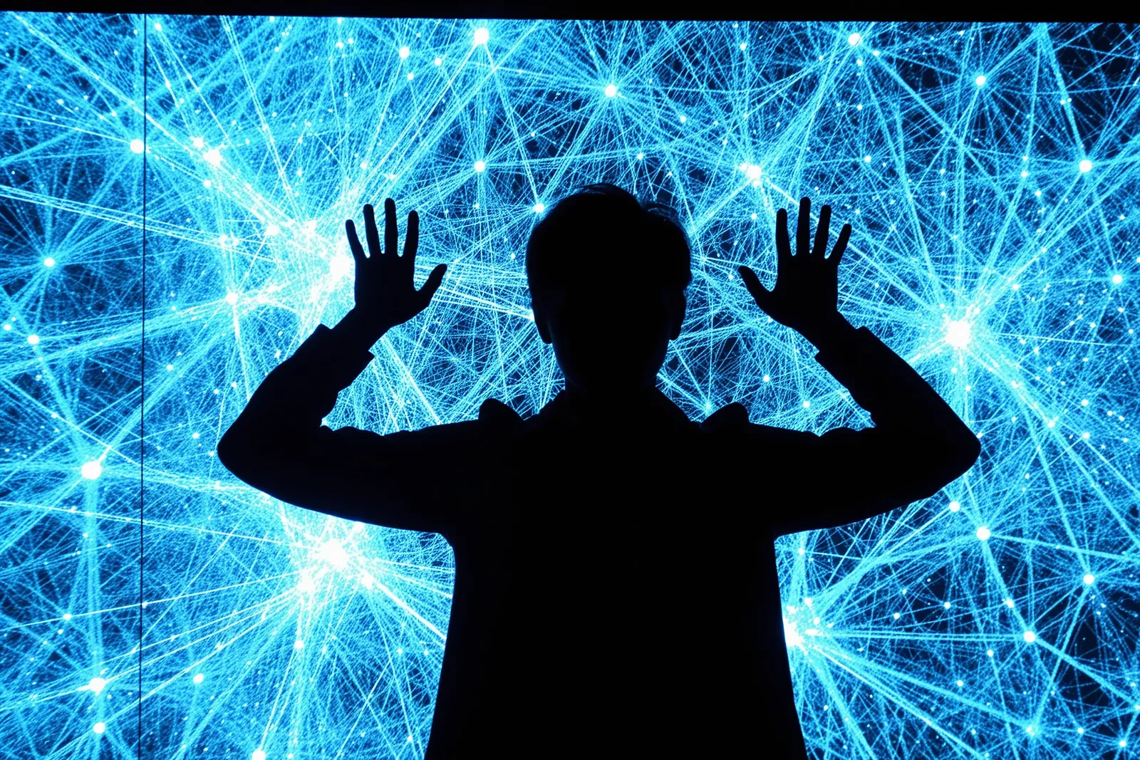 A person speaking at a tech conference about AI safety and regulation.