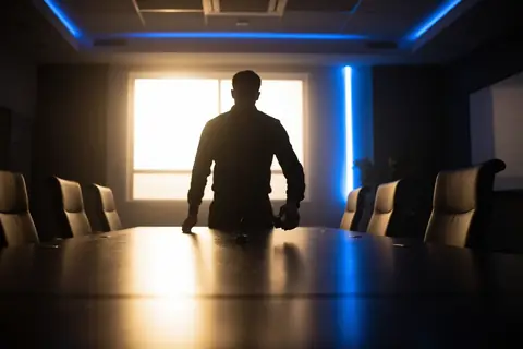A conference room with a hidden recording device, illustrating the OpenAI espionage incident.